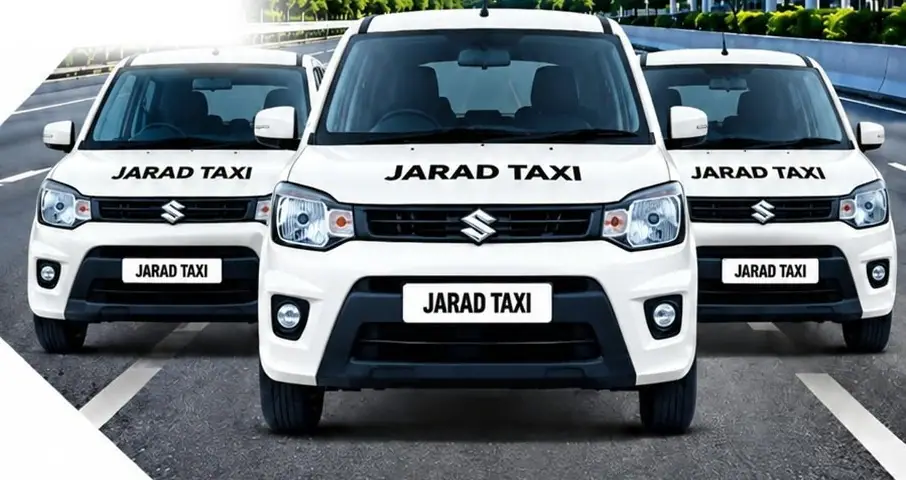Three white JARAD Taxi cars on a city road
